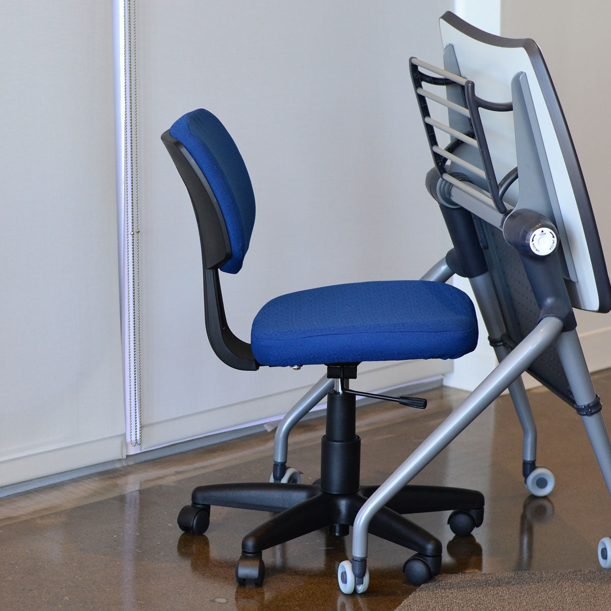 Compact flip top desk in flipped position and blue student task chair