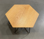 Load image into Gallery viewer, Top view of Herman Miller Pollen table with an oak top
