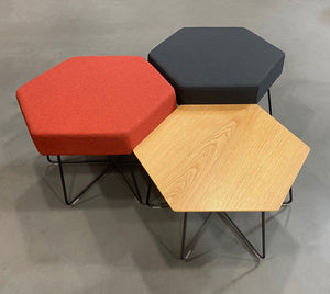 Top View of Herman Miller Pollen table clustered with red and black Pollen stools 