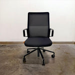 Load image into Gallery viewer, Front view of black Keilhauer Aesync meeting room chair
