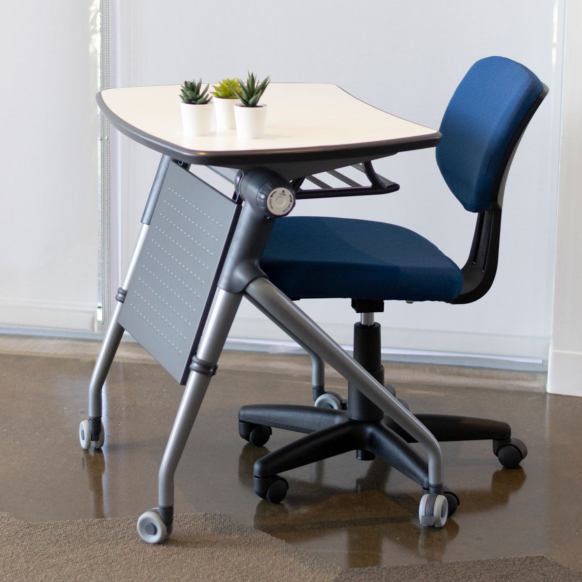 Side view of flip top table with chair nestled in beneath table.