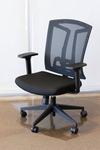 Front view of ergonomic office chair in black mesh back and black fabric seat.
