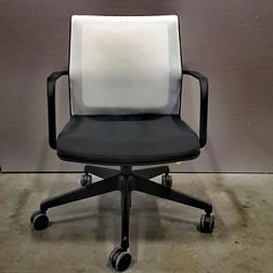 Teknion Project Conference chair with black frame, base and seat and white mesh back fabric